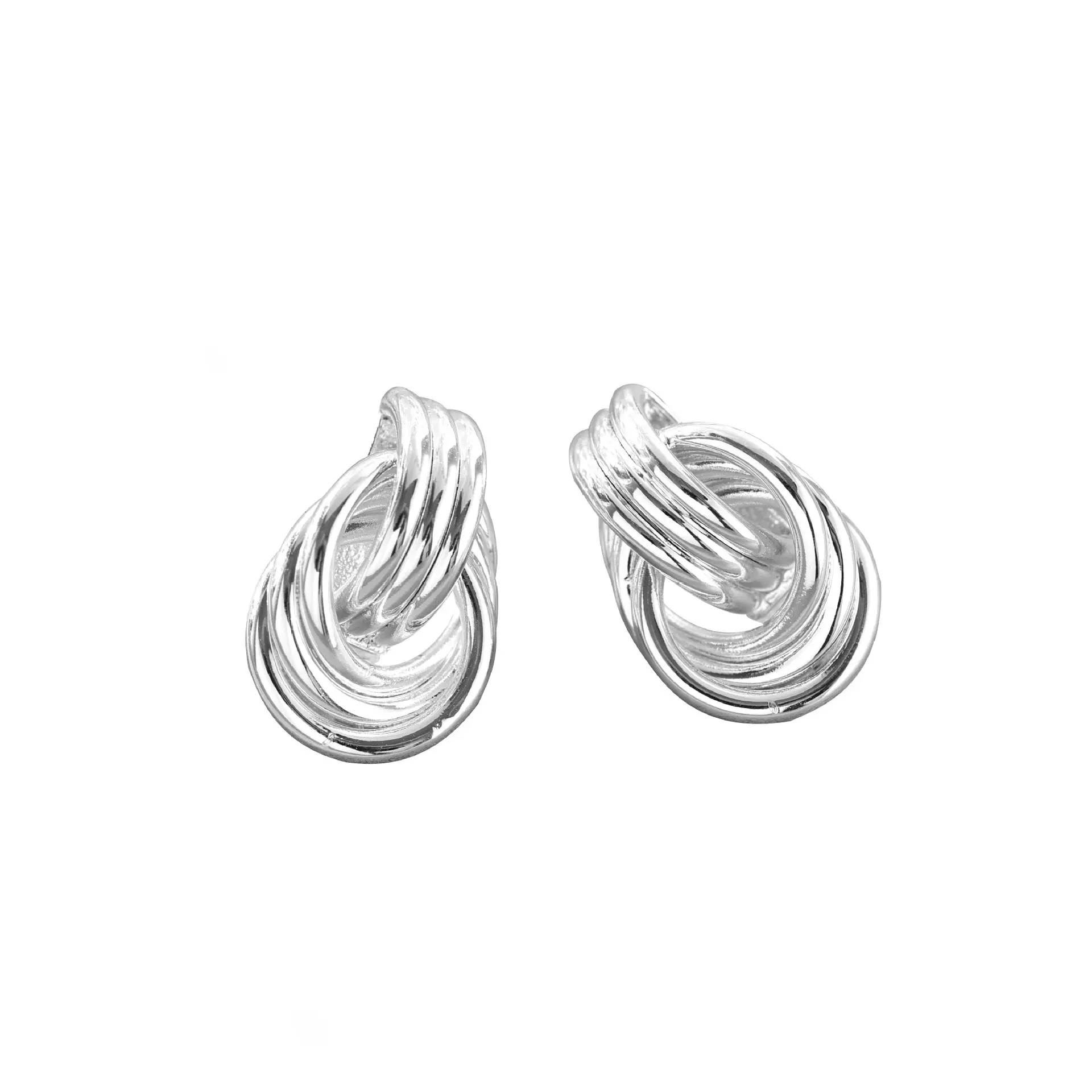 livke-silver-triple-coil-hoop-earrings.jpg LIVKE’s silver geometric hoop earrings with triple coil layers, styled with a sleek bun for minimalist office elegance.