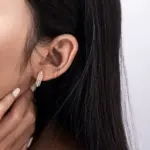 LIVKE’s gold vintage pearl hoop earrings styled with a lace dress for timeless retro elegance.