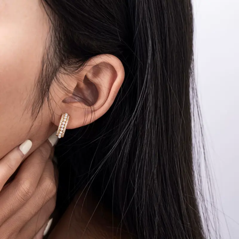 LIVKE’s gold vintage pearl hoop earrings styled with a lace dress for timeless retro elegance.