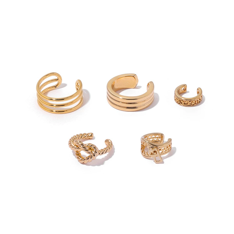 LIVKE’s gold openwork ear cuff styled on a helix, paired with minimalist hoops for edgy everyday elegance.