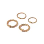 LIVKE’s 18K PVD gold minimalist ring stacked with raw-edge bands for modern gender-neutral style.
