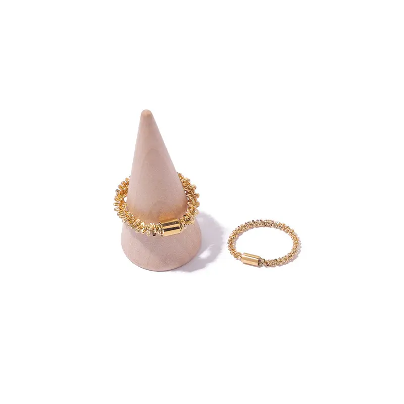 LIVKE’s 18K PVD gold minimalist ring stacked with raw-edge bands for modern gender-neutral style.