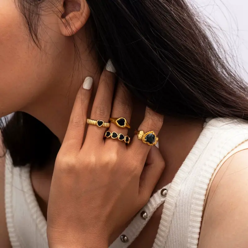 LIVKE’s French-inspired black heart adjustable ring on a hand with black nail polish, styled for edgy everyday elegance.