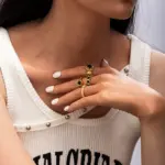 LIVKE’s French-inspired black heart adjustable ring on a hand with black nail polish, styled for edgy everyday elegance.
