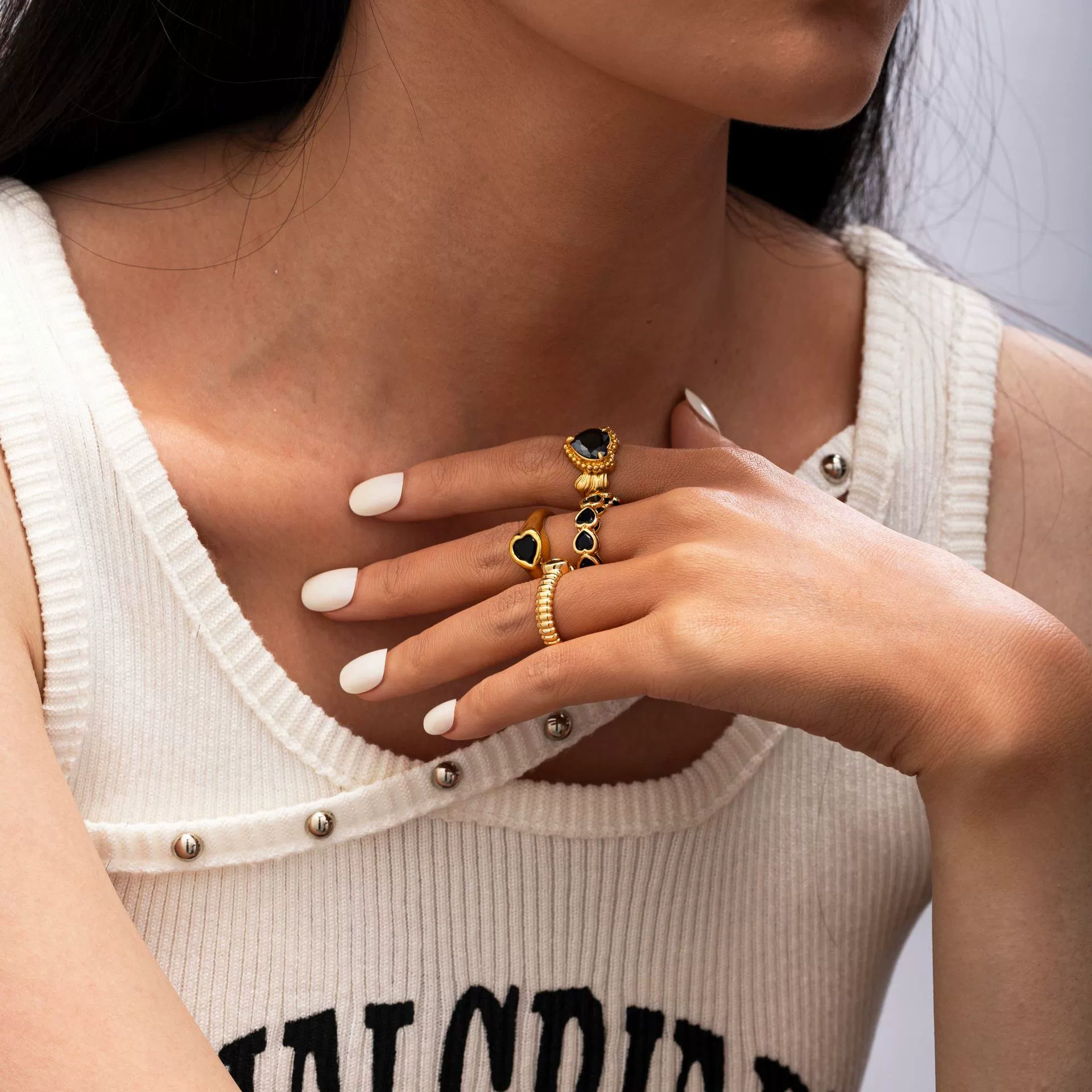 LIVKE’s French-inspired black heart adjustable ring on a hand with black nail polish, styled for edgy everyday elegance.