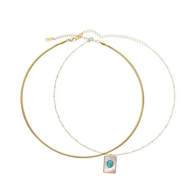 LIVKE’s gold snake chain necklace with shell and turquoise pendant, layered with beaded bracelets for boho summer style.