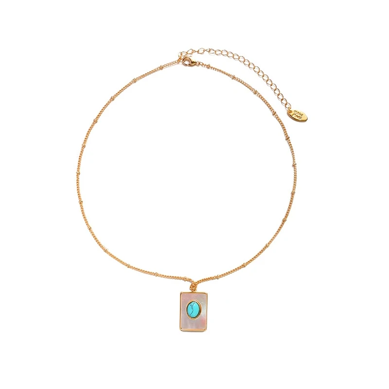 LIVKE’s gold snake chain necklace with shell and turquoise pendant, layered with beaded bracelets for boho summer style.