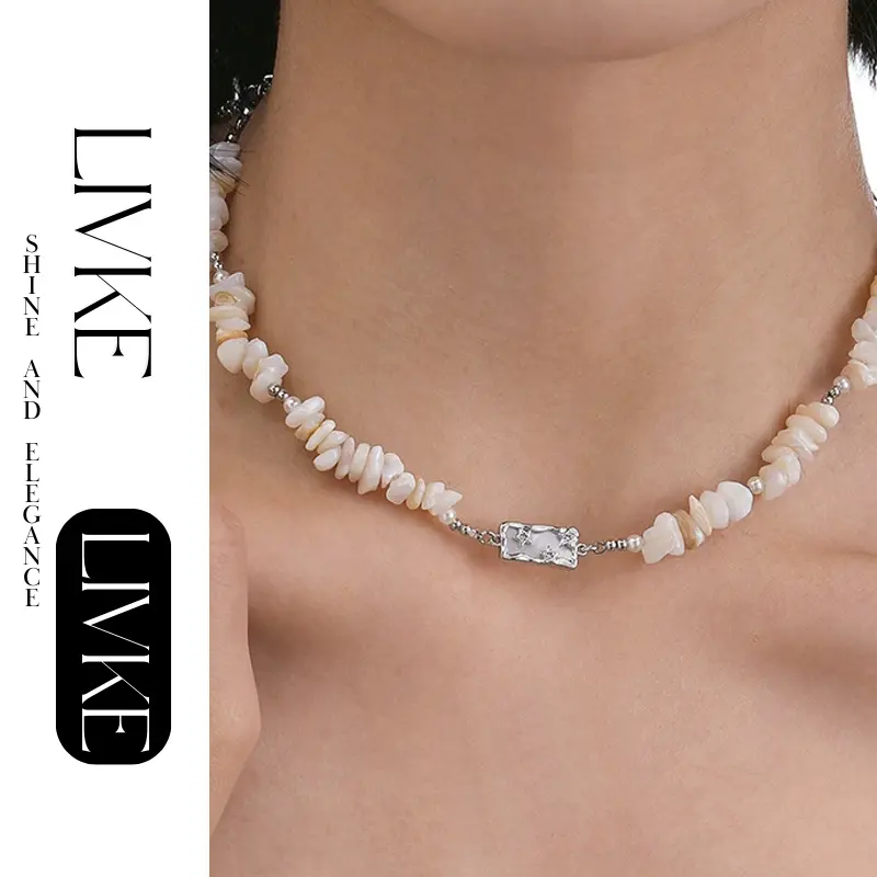 LIVKE’s single-strand boho beach necklace with shells and gold accents, styled with a white tank top for minimalist coastal style.