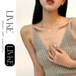 LIVKE’s gold enamel heart pendant necklace styled with a floral dress for Parisian-inspired everyday charm.