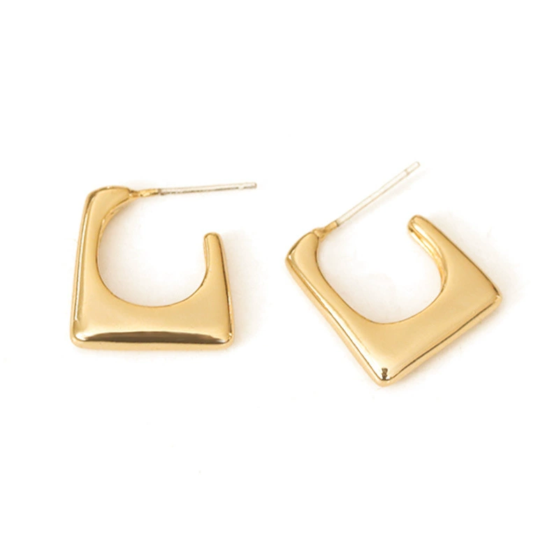 LIVKE’s gold geometric square hoop earrings styled with a black turtleneck for minimalist urban elegance.