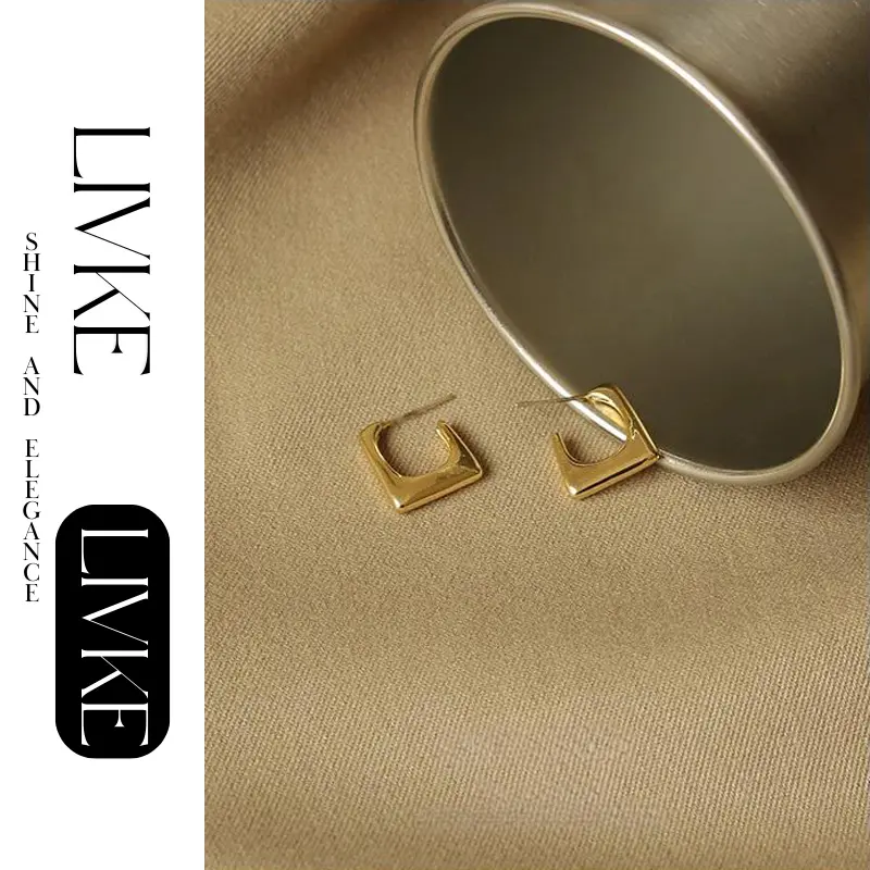 LIVKE’s gold geometric square hoop earrings styled with a black turtleneck for minimalist urban elegance.