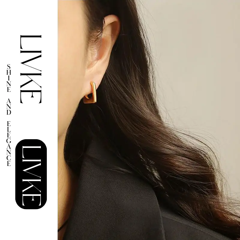 LIVKE’s gold geometric square hoop earrings styled with a black turtleneck for minimalist urban elegance.