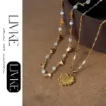 LIVKE’s gold layered heart necklaces styled with a black turtleneck for minimalist everyday elegance.