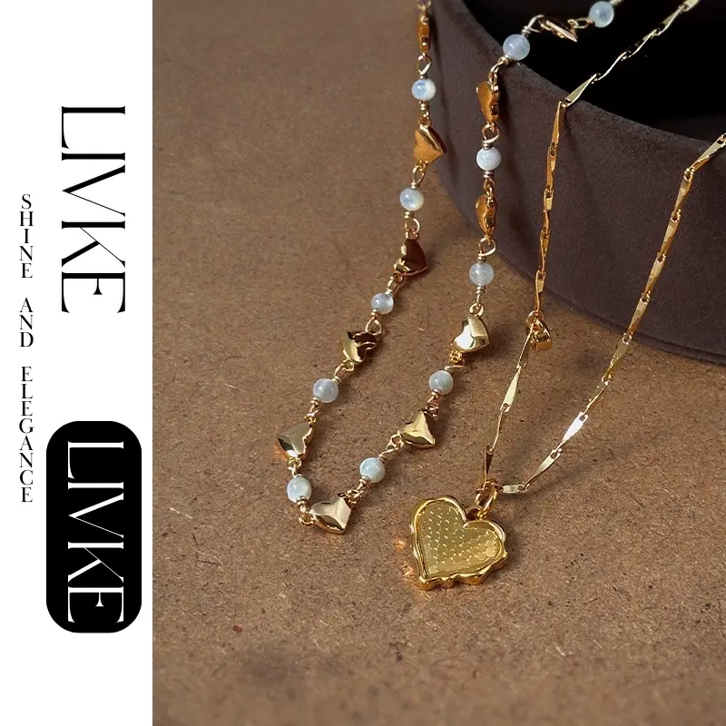 LIVKE’s gold layered heart necklaces styled with a black turtleneck for minimalist everyday elegance.