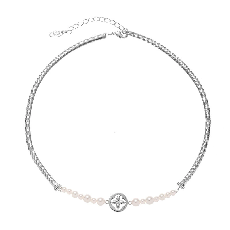 LIVKE’s gold tulip pendant necklace with faux pearl, styled with a trench coat for transitional elegance.