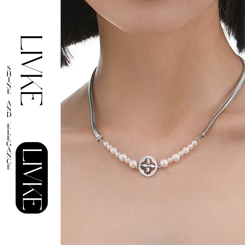 LIVKE’s gold tulip pendant necklace with faux pearl, styled with a trench coat for transitional elegance.