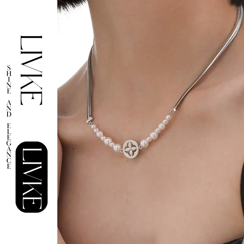 LIVKE’s gold tulip pendant necklace with faux pearl, styled with a trench coat for transitional elegance.
