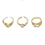 LIVKE’s gold leaf and pearl adjustable ring on a hand with neutral nails, styled with a linen dress for effortless boho elegance.