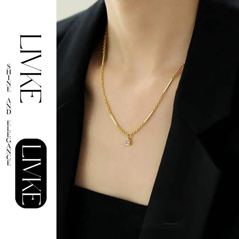 LIVKE’s gold-plated square zircon pendant necklace styled with a white silk blouse for timeless elegance.