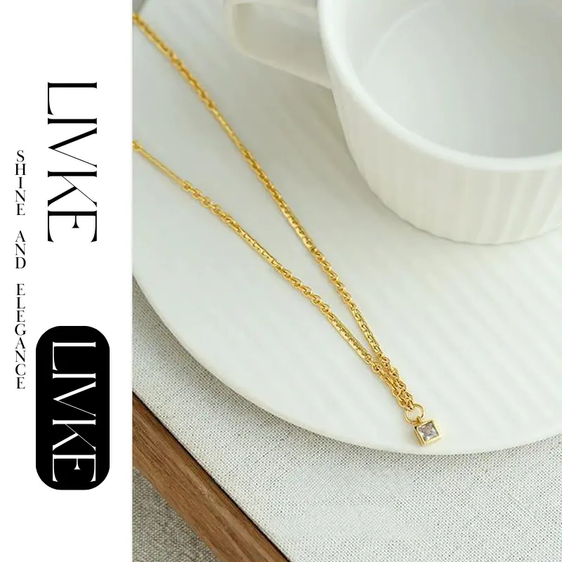 LIVKE’s gold-plated square zircon pendant necklace styled with a white silk blouse for timeless elegance.