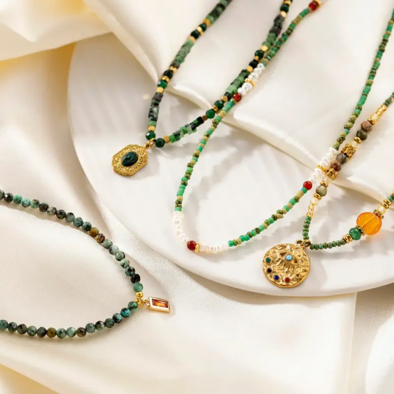 Adjustable LIVKE brass necklace with amethyst and turquoise beads layered over linen dress for bohemian everyday style.