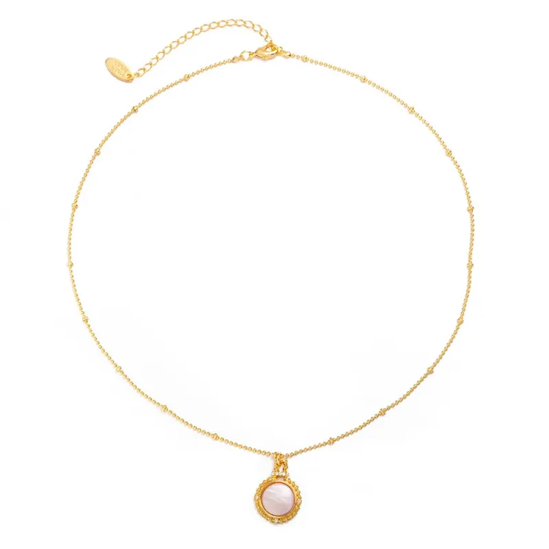 Woman wearing LIVKE vintage cubic zirconia necklace with turtleneck and trench coat, showcasing minimalist retro jewelry for urban elegance