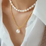 Woman wearing LIVKE braided gold chain pearl necklace with tailored blouse, showcasing minimalist office jewelry