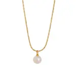 Woman wearing LIVKE braided gold chain pearl necklace with tailored blouse, showcasing minimalist office jewelry