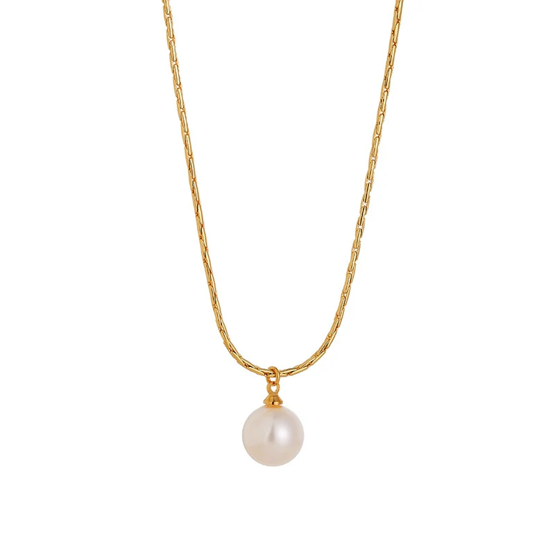 Woman wearing LIVKE braided gold chain pearl necklace with tailored blouse, showcasing minimalist office jewelry