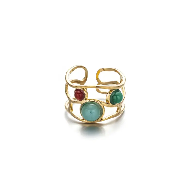 Hand wearing LIVKE triple-layered titanium ring with natural stone inlay during business meeting and cocktail party, showcasing versatile power jewelry