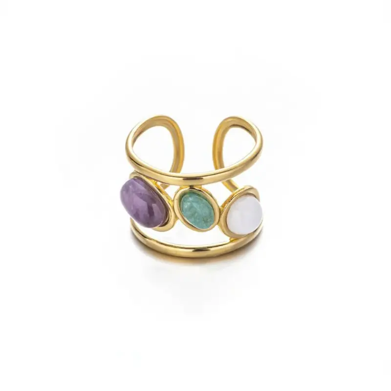 Hand wearing LIVKE triple-layered titanium ring with natural stone inlay during business meeting and cocktail party, showcasing versatile power jewelry