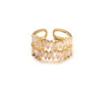 Eclectic woman stacking LIVKE gold textured rings on fingers while browsing vintage market, showcasing bohemian jewelry styling