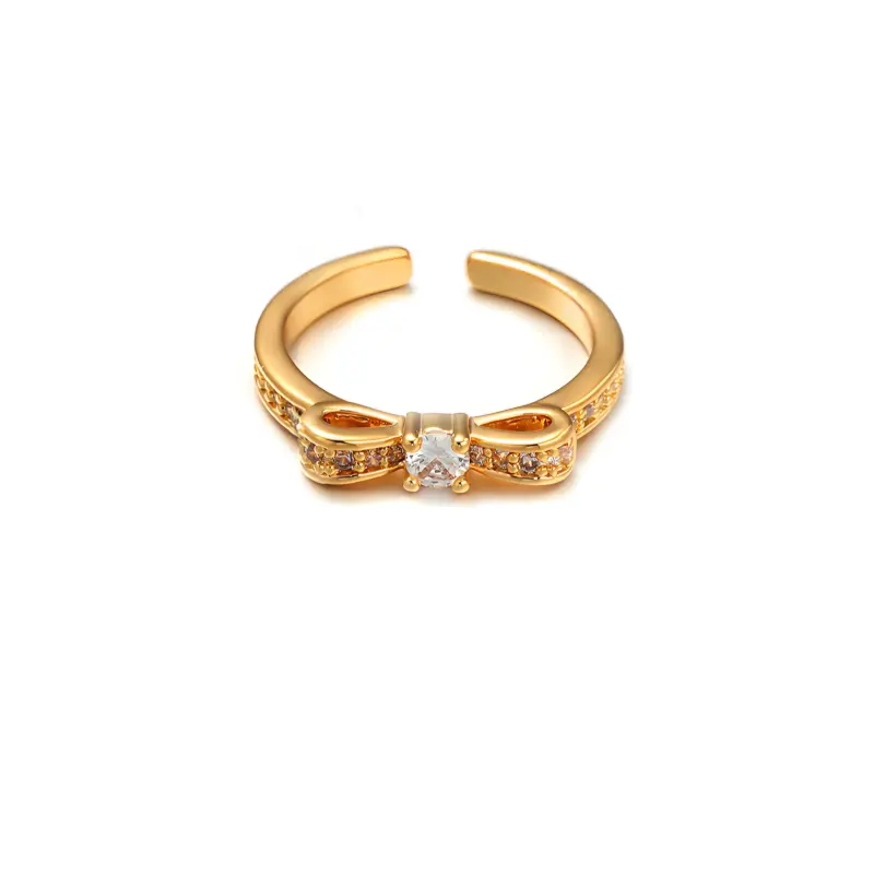 Eclectic woman stacking LIVKE gold textured rings on fingers while browsing vintage market, showcasing bohemian jewelry styling