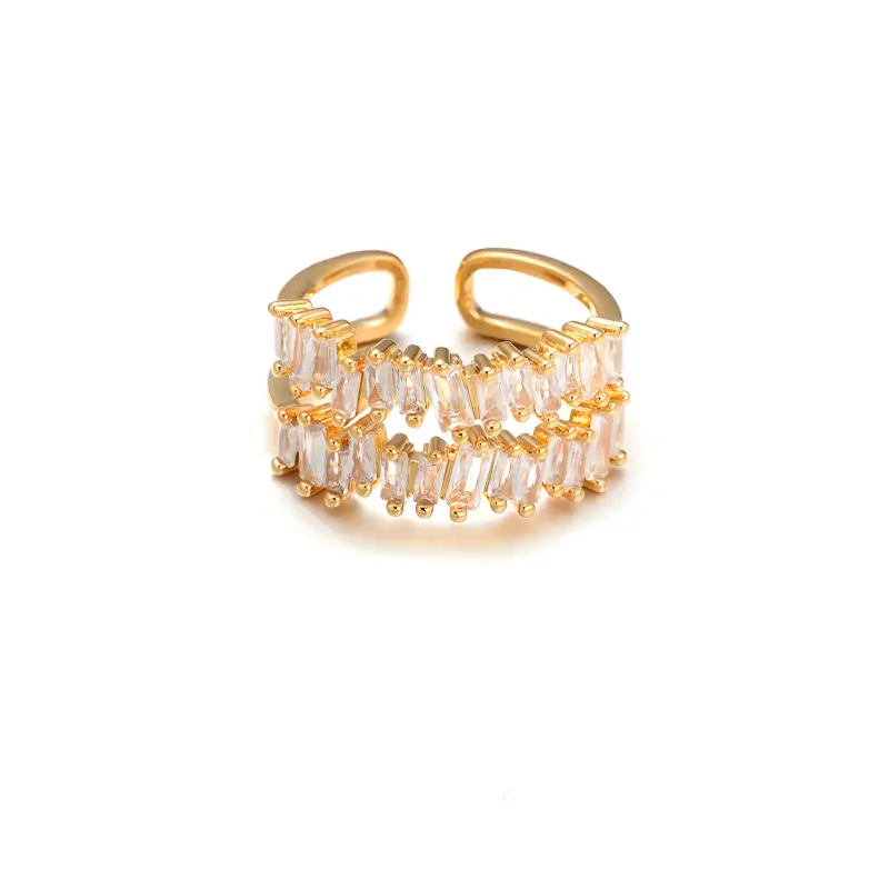Eclectic woman stacking LIVKE gold textured rings on fingers while browsing vintage market, showcasing bohemian jewelry styling