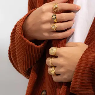 Woman stacking LIVKE textured gold rings with UV color shift effect for TikTok transition video