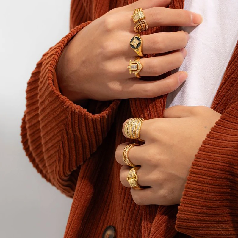 Woman stacking LIVKE textured gold rings with UV color shift effect for TikTok transition video