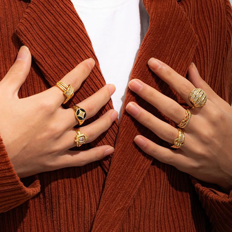 Woman stacking LIVKE textured gold rings with UV color shift effect for TikTok transition video