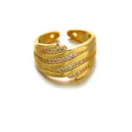 Woman stacking LIVKE textured gold rings with UV color shift effect for TikTok transition video