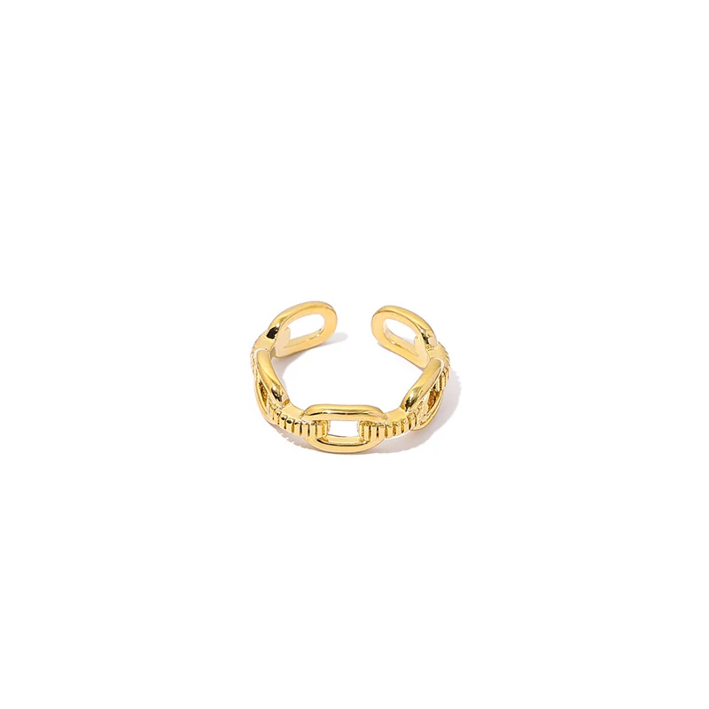 Stacked LIVKE braided and chain rings on hand with bohemian embroidery sleeve, showcasing boho-chic layering.