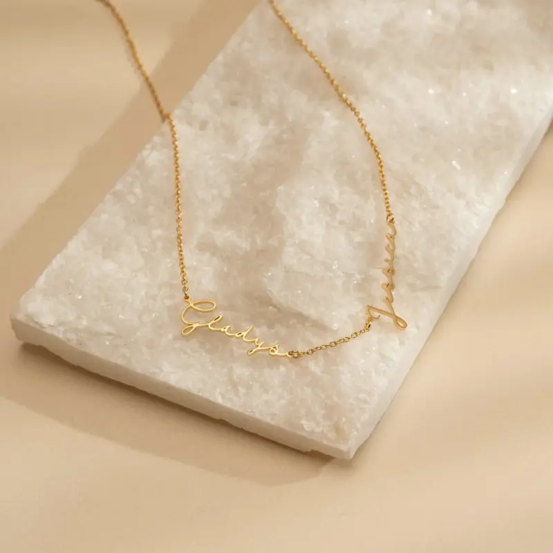 Gold name necklace with 'Believe' engraved in modern font on collarbone