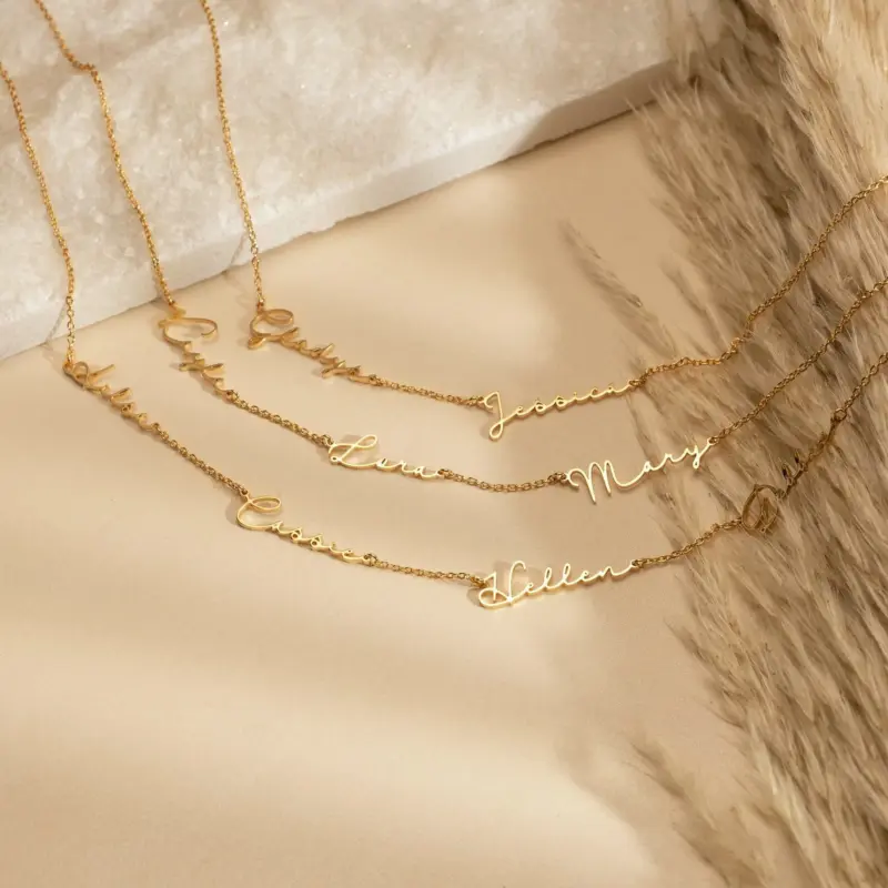 Gold name necklace with 'Believe' engraved in modern font on collarbone