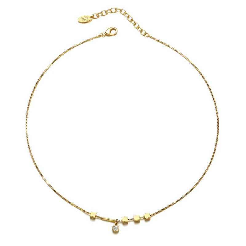 Professional woman wearing LIVKE square zirconia necklace with blazer and silk shirt, showcasing minimalist office jewelry for modern workwear