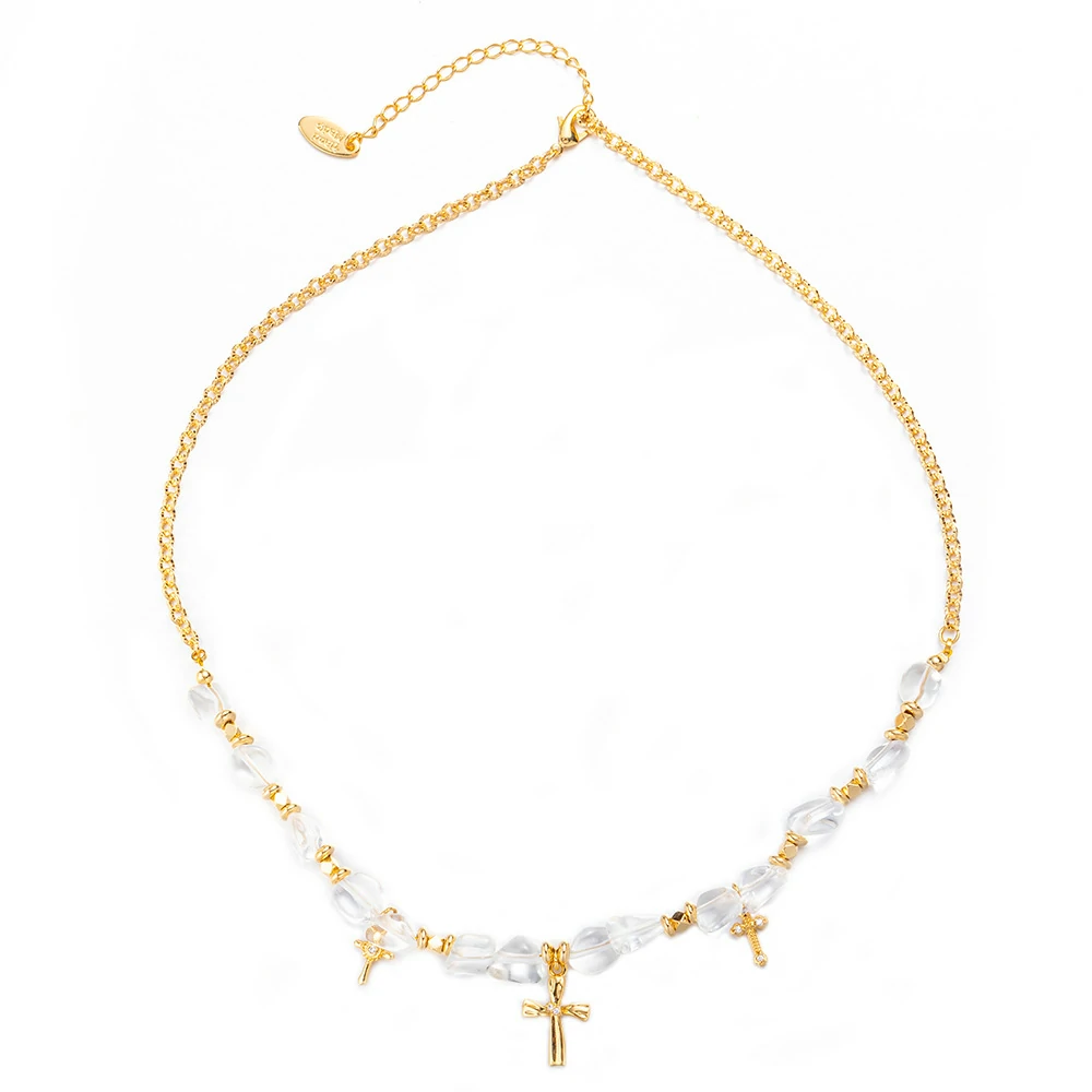 livke-gold-cross-zirconia-bead-necklace-layering (2) Young woman wearing LIVKE gold cross necklace with layered chains at music festival, blending spiritual jewelry with bohemian style