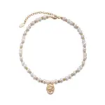 Gold Plated Brass Pearl Necklace 1 Woman wearing LIVKE gold plated pearl necklace with silk blouse and tailored blazer, showcasing vintage-inspired office to evening jewelry