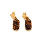 Woman wearing LIVKE teardrop tiger eye earrings with tailored blazer, showcasing minimalist office jewelry with natural stone accents