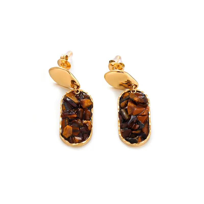 Woman wearing LIVKE teardrop tiger eye earrings with tailored blazer, showcasing minimalist office jewelry with natural stone accents