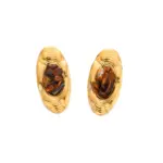 Woman wearing LIVKE teardrop tiger eye earrings with tailored blazer, showcasing minimalist office jewelry with natural stone accents