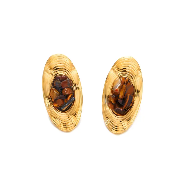 Woman wearing LIVKE teardrop tiger eye earrings with tailored blazer, showcasing minimalist office jewelry with natural stone accents