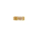 Hand wearing LIVKE gold zircon rings with geometric layout, paired with minimalist bands for urban chic style