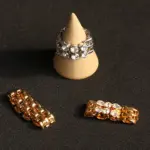 Hand wearing LIVKE gold zircon rings with geometric layout, paired with minimalist bands for urban chic style